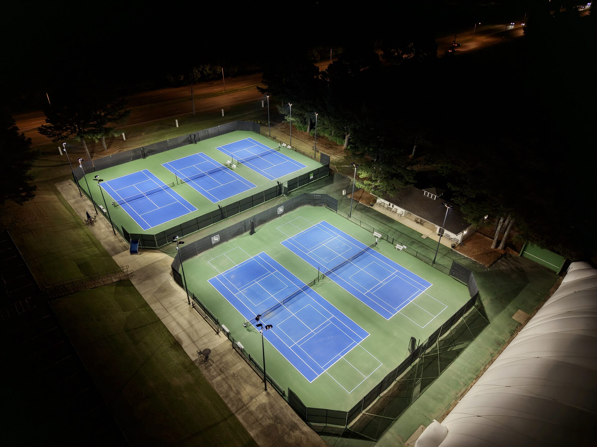 Aerial view of Windyke Country Club tennis courts and dome at night